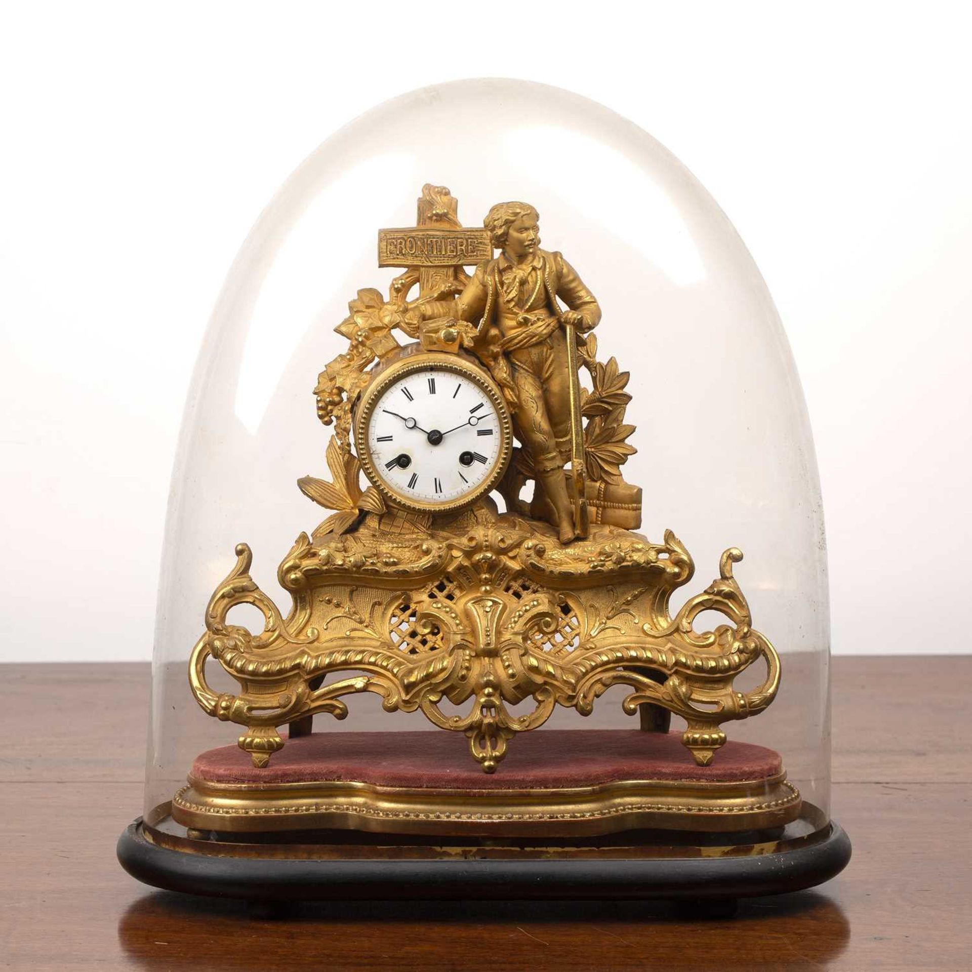 Gilt metal mantel clock French, 19th Century, with an enamel dial flanked by a figure leaning