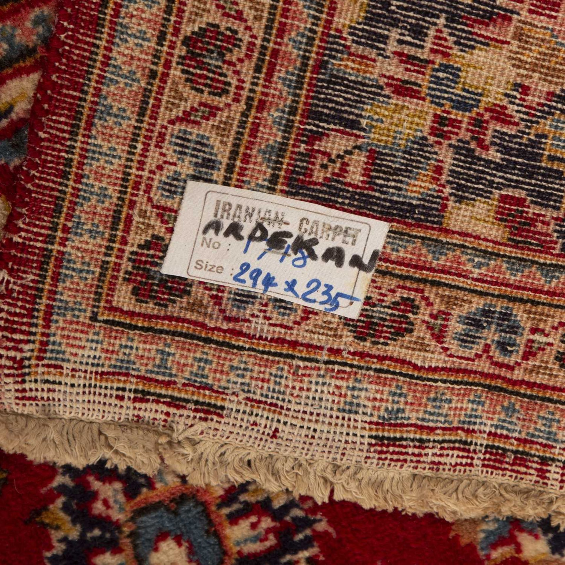 Ardekan red and blue ground wool carpet Iranian, with floral and foliate designs in and around a - Image 2 of 2