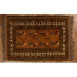 Afghan gold ground rug with traditional panelled designs, 128cm x 84.5cmIn generally good condition