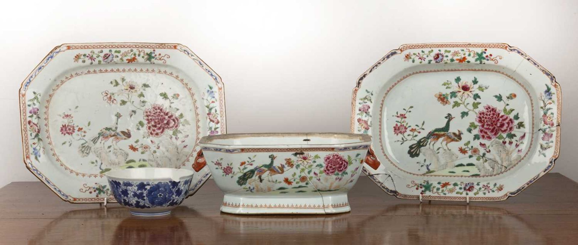 Famille rose porcelain tureen base and two stands Chinese, Qianlong period, painted with peonies,