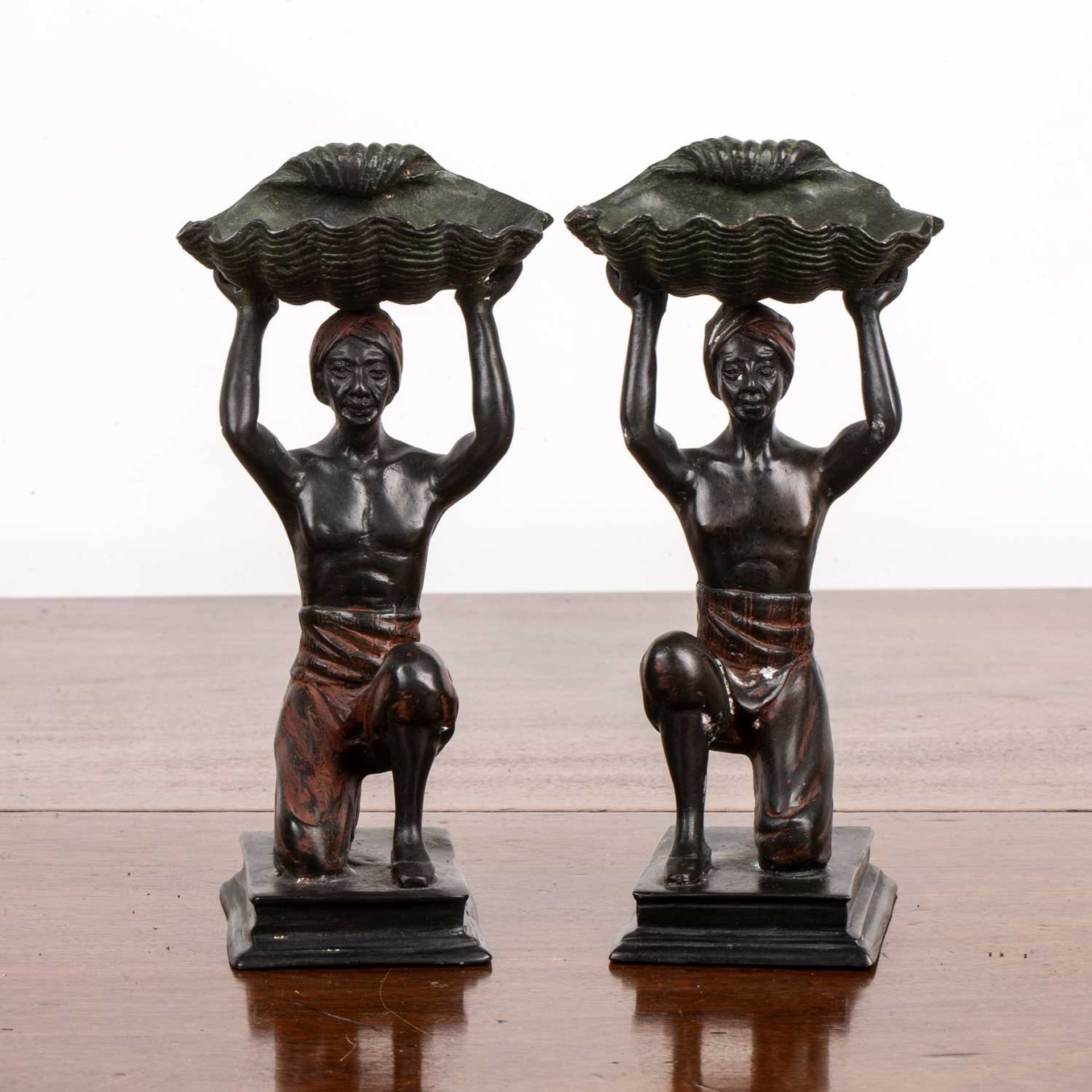 After Franz Bergmann Pair of cold-painted bronze figures, each supporting a shell, 21cm high In