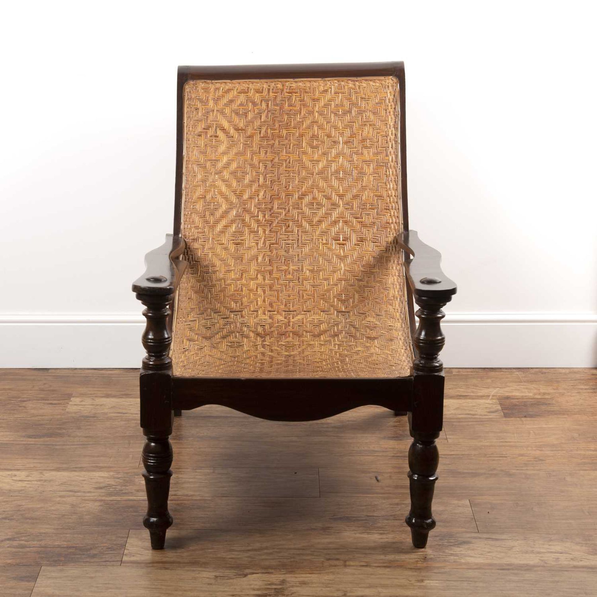 Plantation chair having a stained wood frame and woven rattan seat, 94cm high, 70cm wide overall x - Image 2 of 4