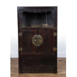 Stained wood cupboard Chinese, early 20th Century, with open top with carved surround and with