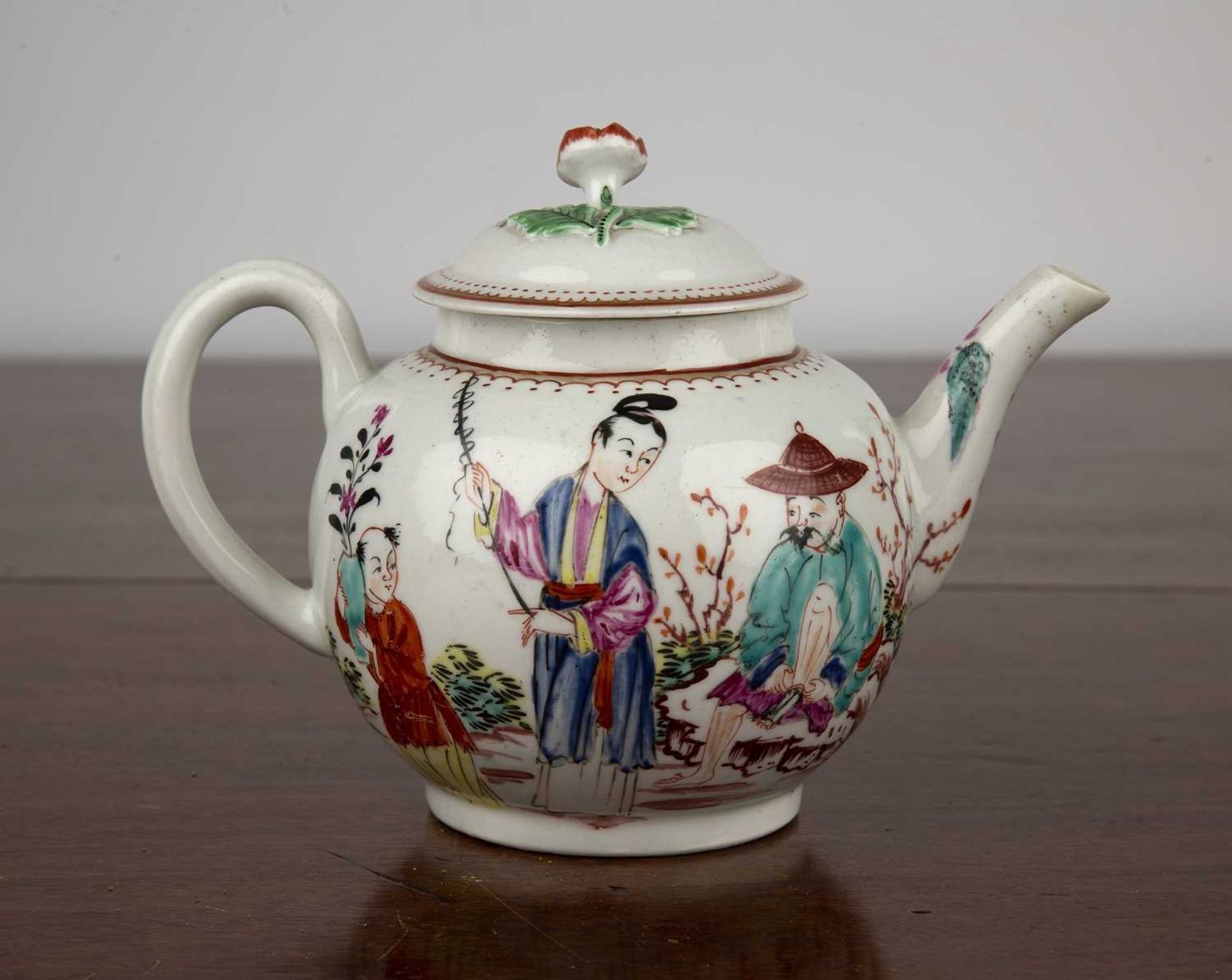 Porcelain teapot, probably Worcester circa 1770, painted with Chinese figures and with a flower - Image 2 of 3