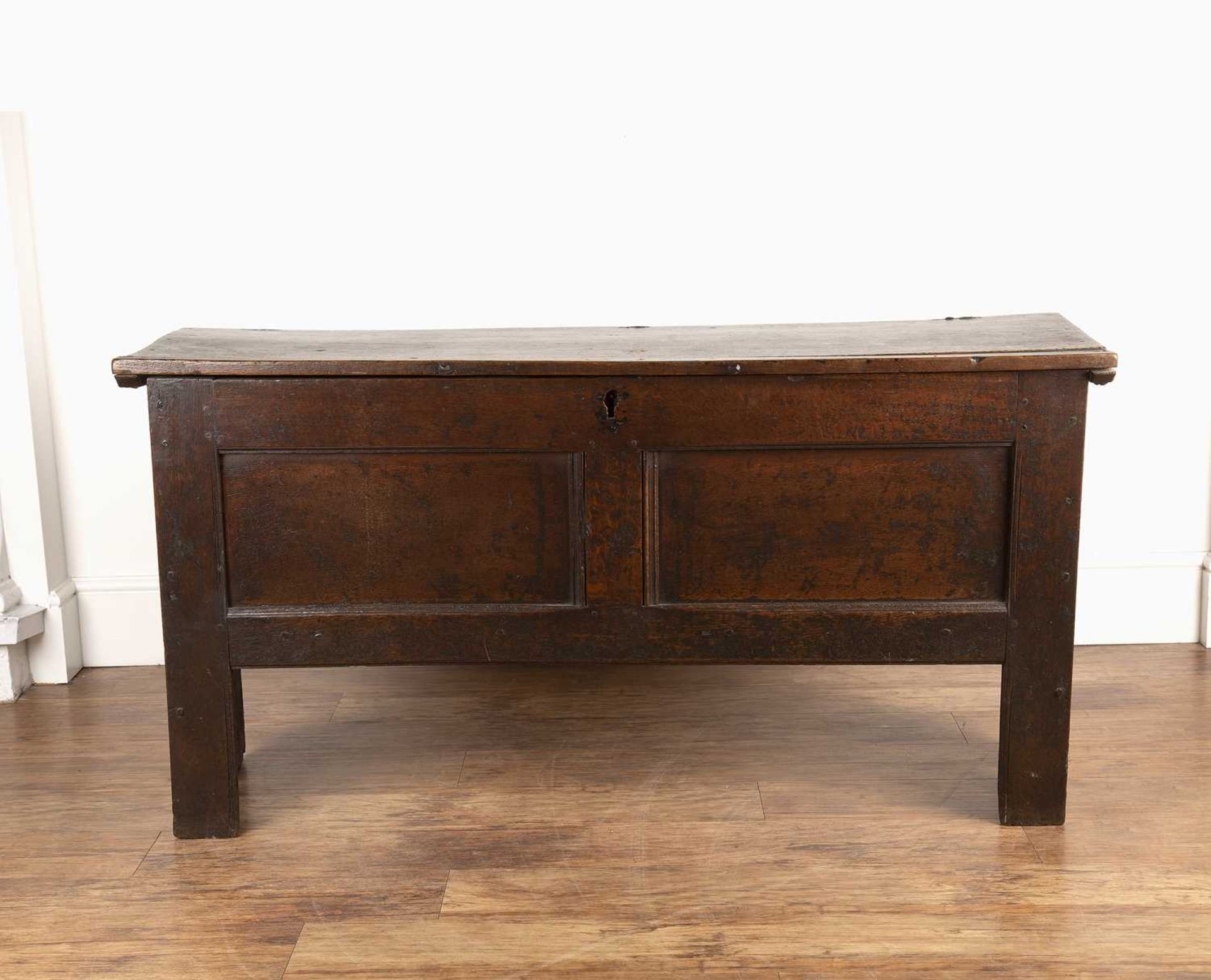 Oak coffer late 17th Century, with a plain double panel front and with iron hinges, 132.5cm wide x