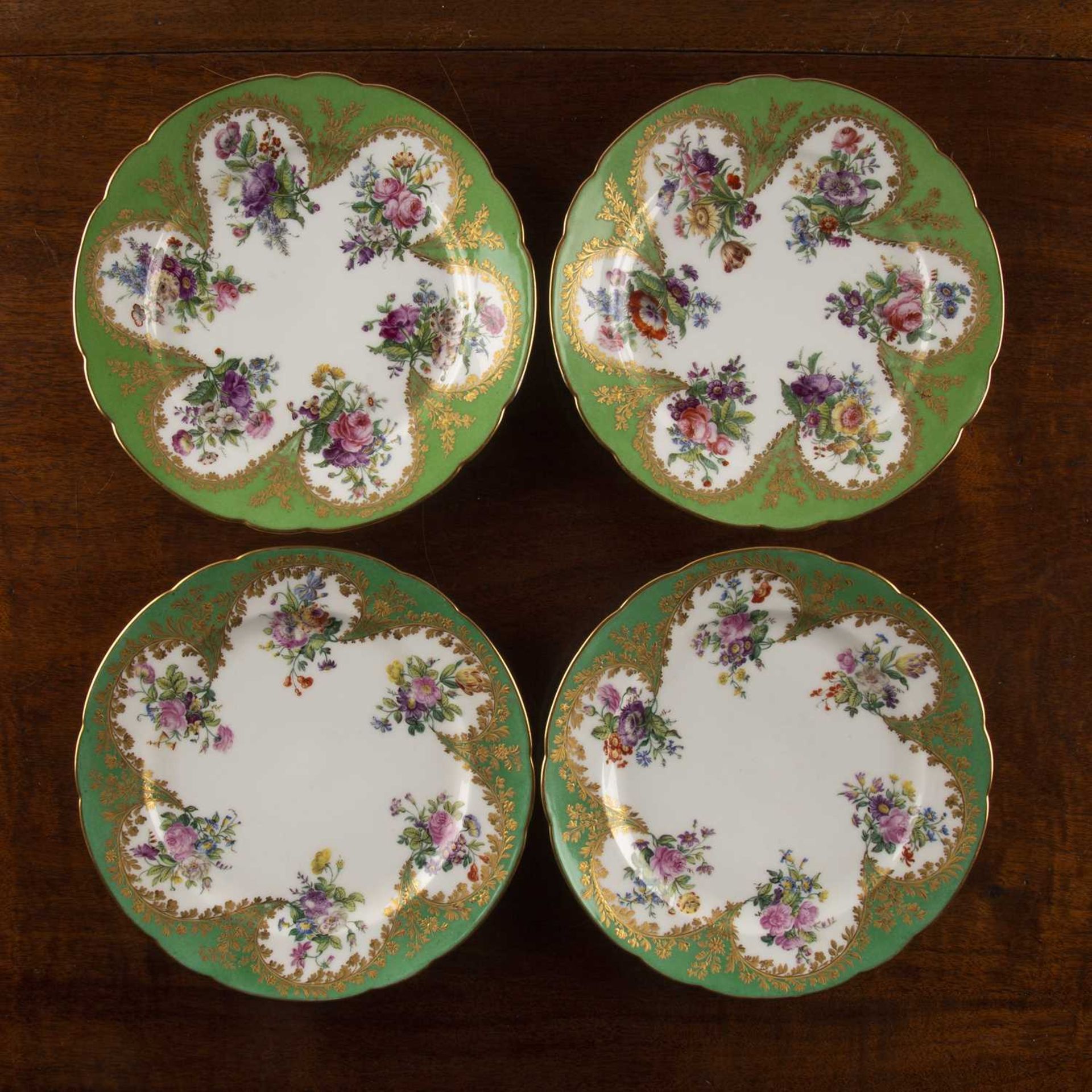 Four porcelain cabinet plates two early 19th Century and two later, white ground with green