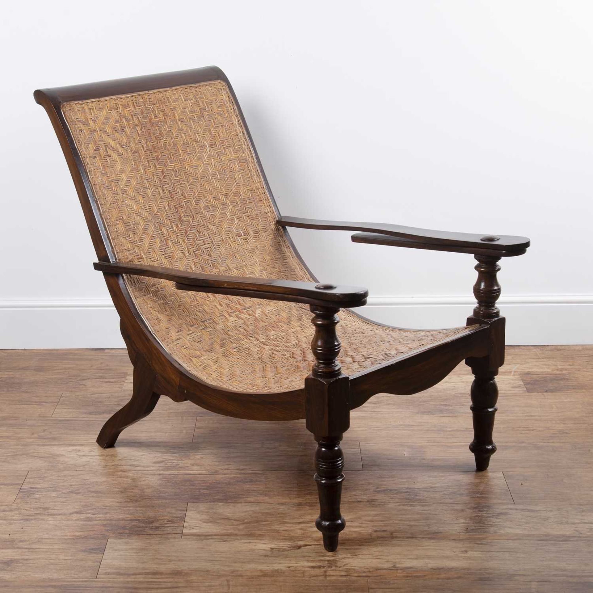 Plantation chair having a stained wood frame and woven rattan seat, 94cm high, 70cm wide overall x - Image 3 of 4