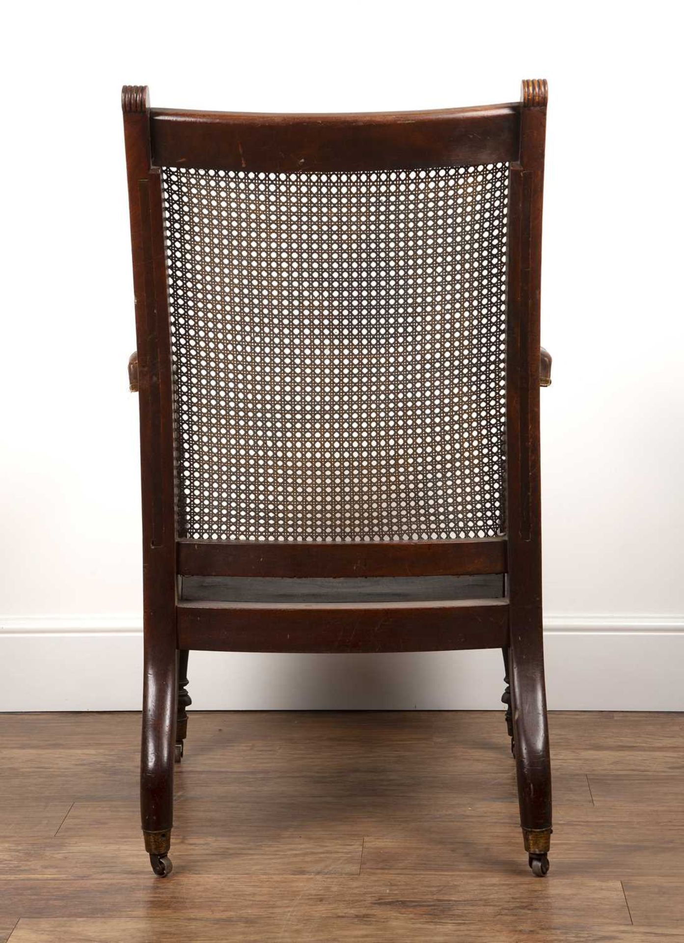 Mahogany Bergere library chair 19th Century, with leather and brass studded armrests with cane to - Bild 4 aus 4