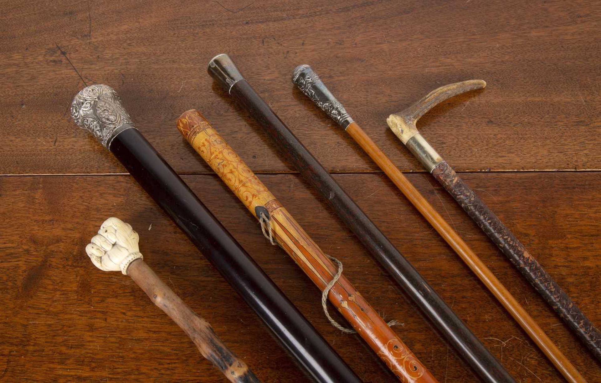 Collection of Victorian and later walking canes and riding crops, comprising of: a Sinhalese