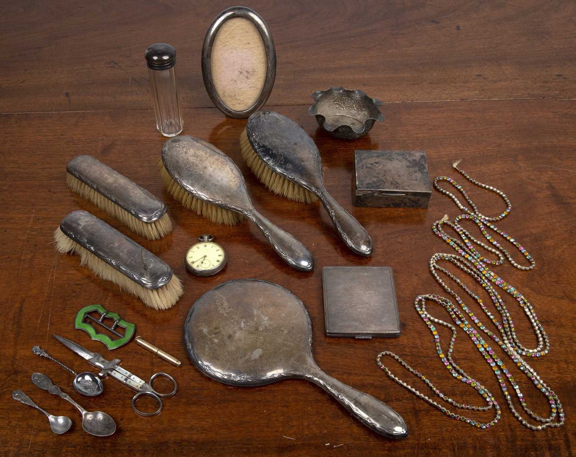 Group of miscellaneous silver comprising of: silver backed dressing table brushes, spoons, oval