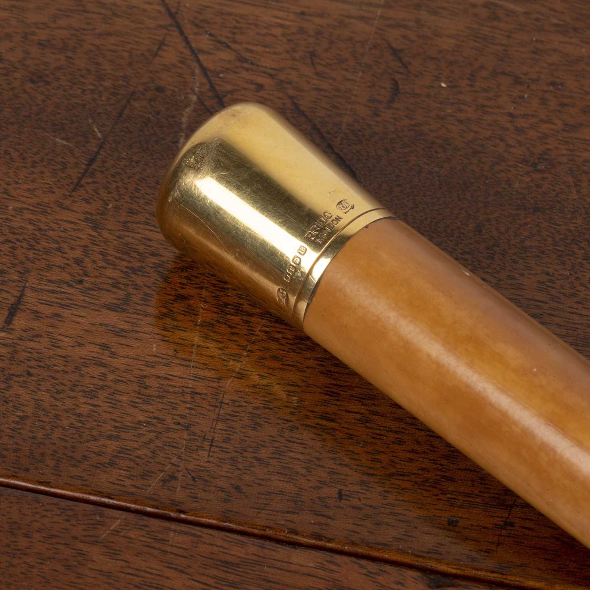 18ct gold topped malacca walking cane with full London hallmark and retailers mark for Brigg of