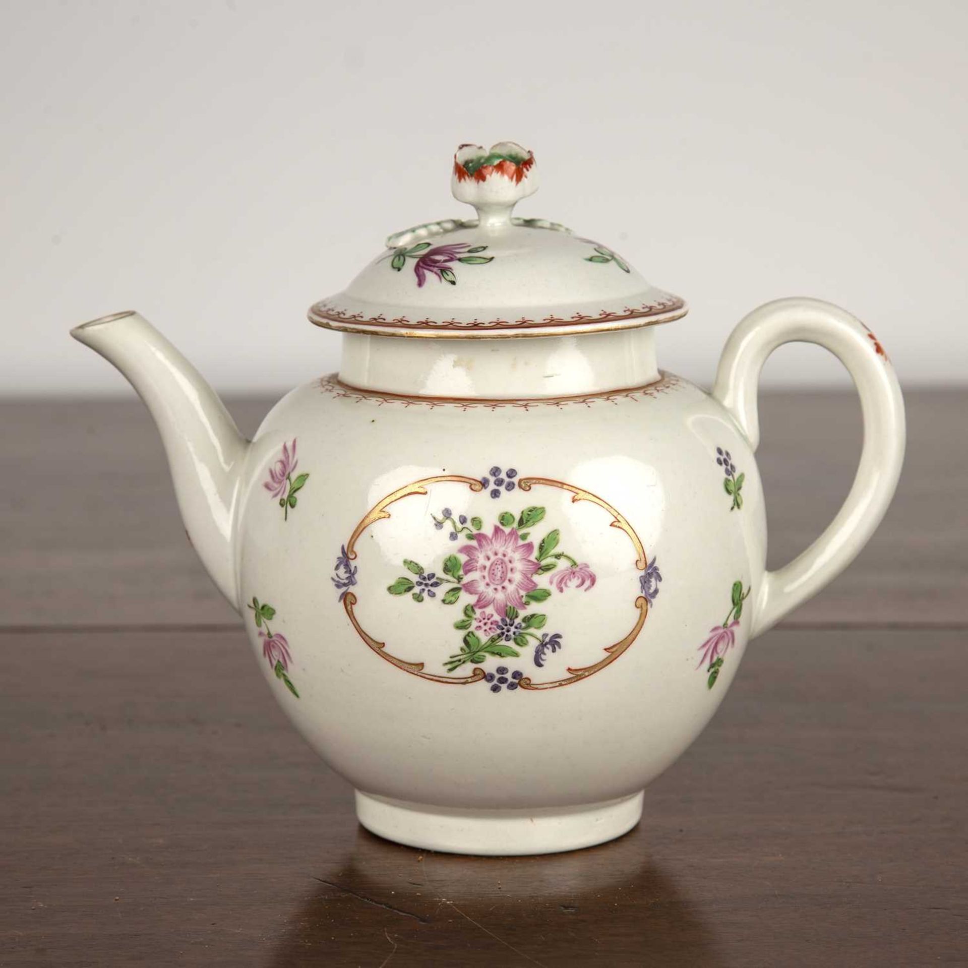Porcelain teapot, probably Worcester circa 1770, painted with panels of flowers and with flower