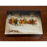 Russian lacquered box 20th Century, painted scene of figures in horse drawn troikas, signed and