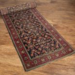 Hamadan blue ground runner with all-over foliate decoration and red ground border, 372cm x