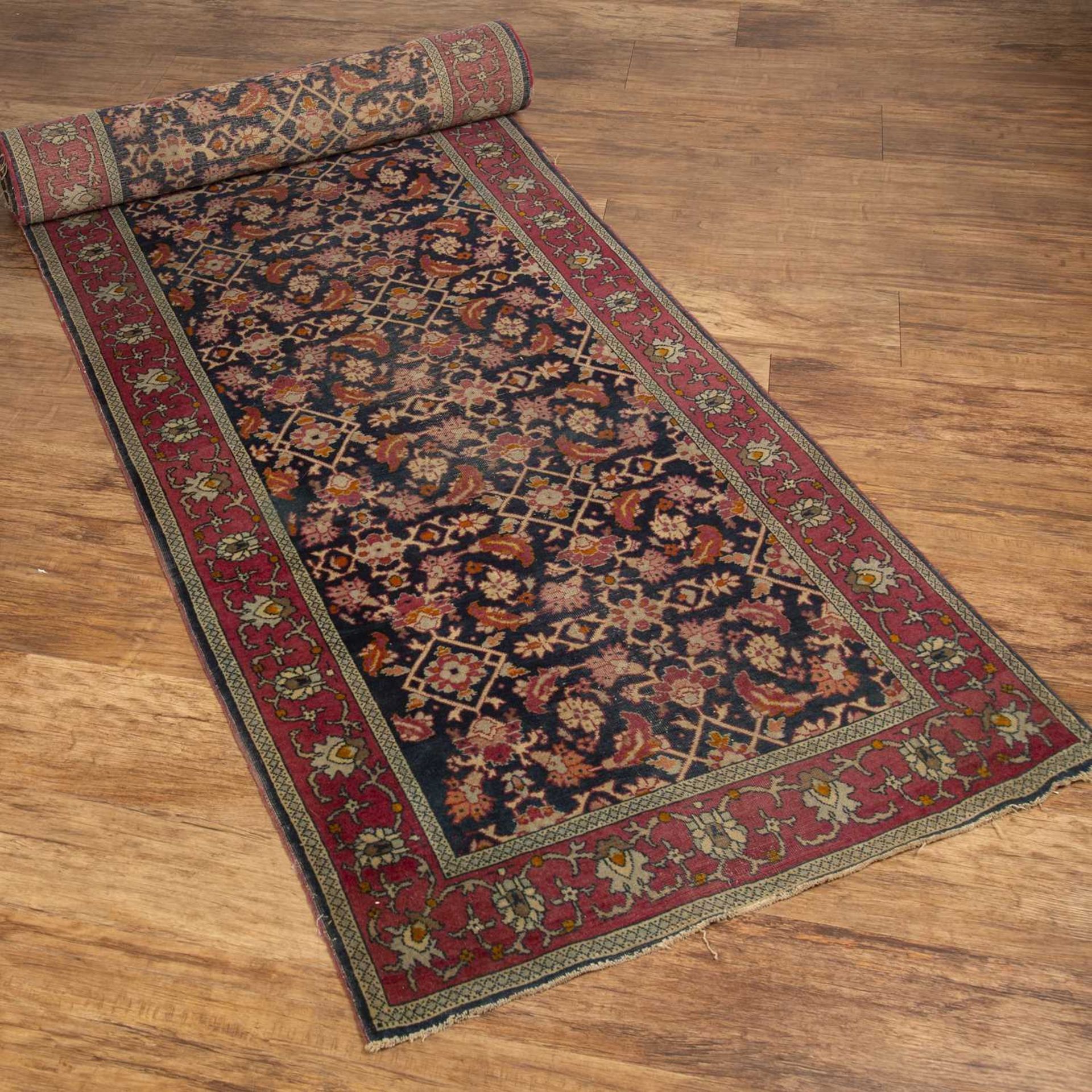 Hamadan blue ground runner with all-over foliate decoration and red ground border, 372cm x