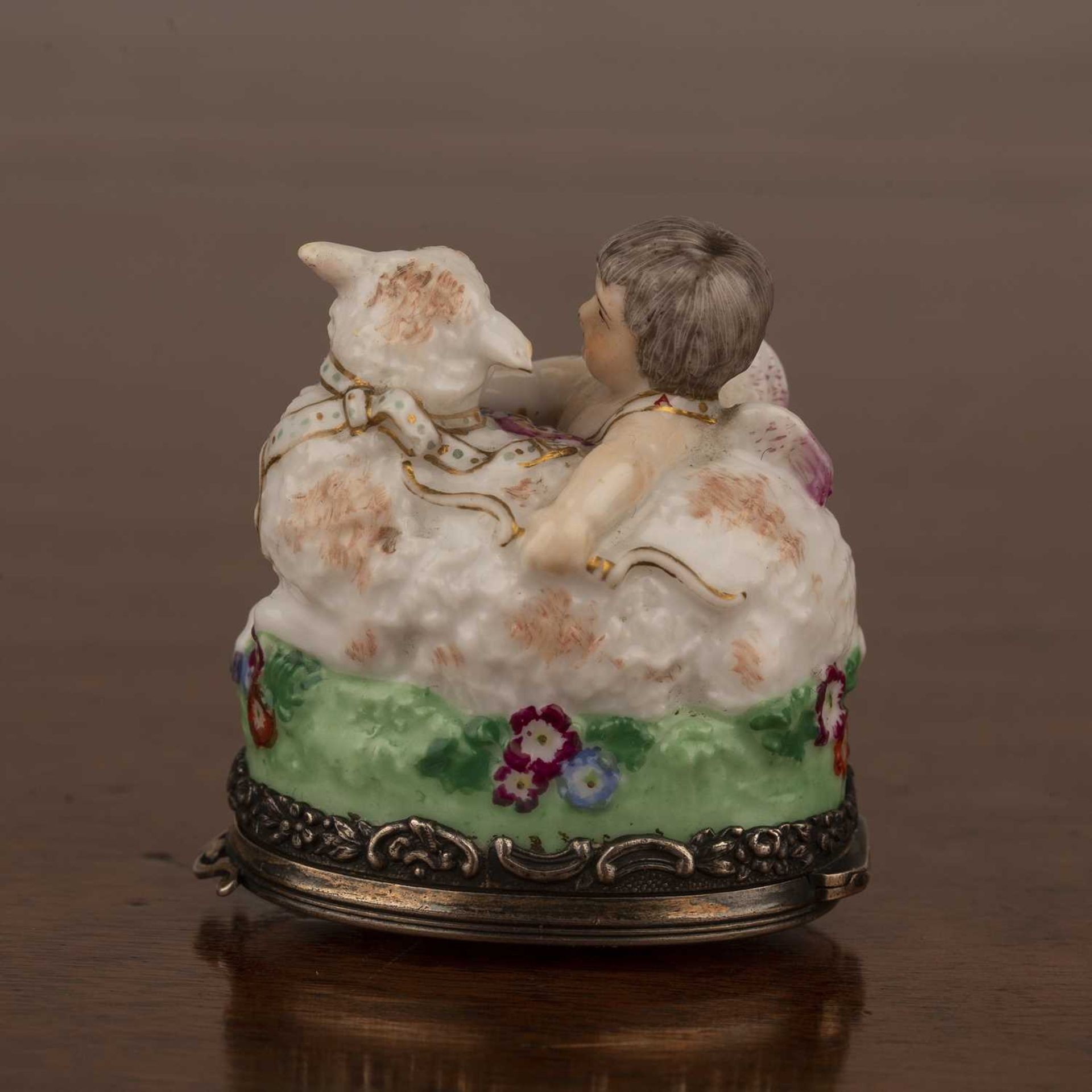 Porcelain bonbonierre French, late 19th Century modelled as a cupid and sheep, with silver metal - Image 2 of 4