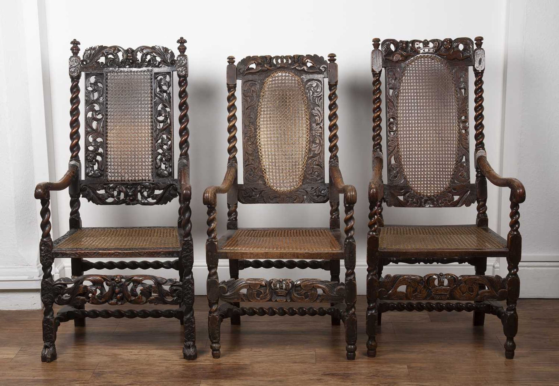 Three similar walnut armchairs Carolean and later, each with carved putti and coronet, and cane - Image 2 of 3
