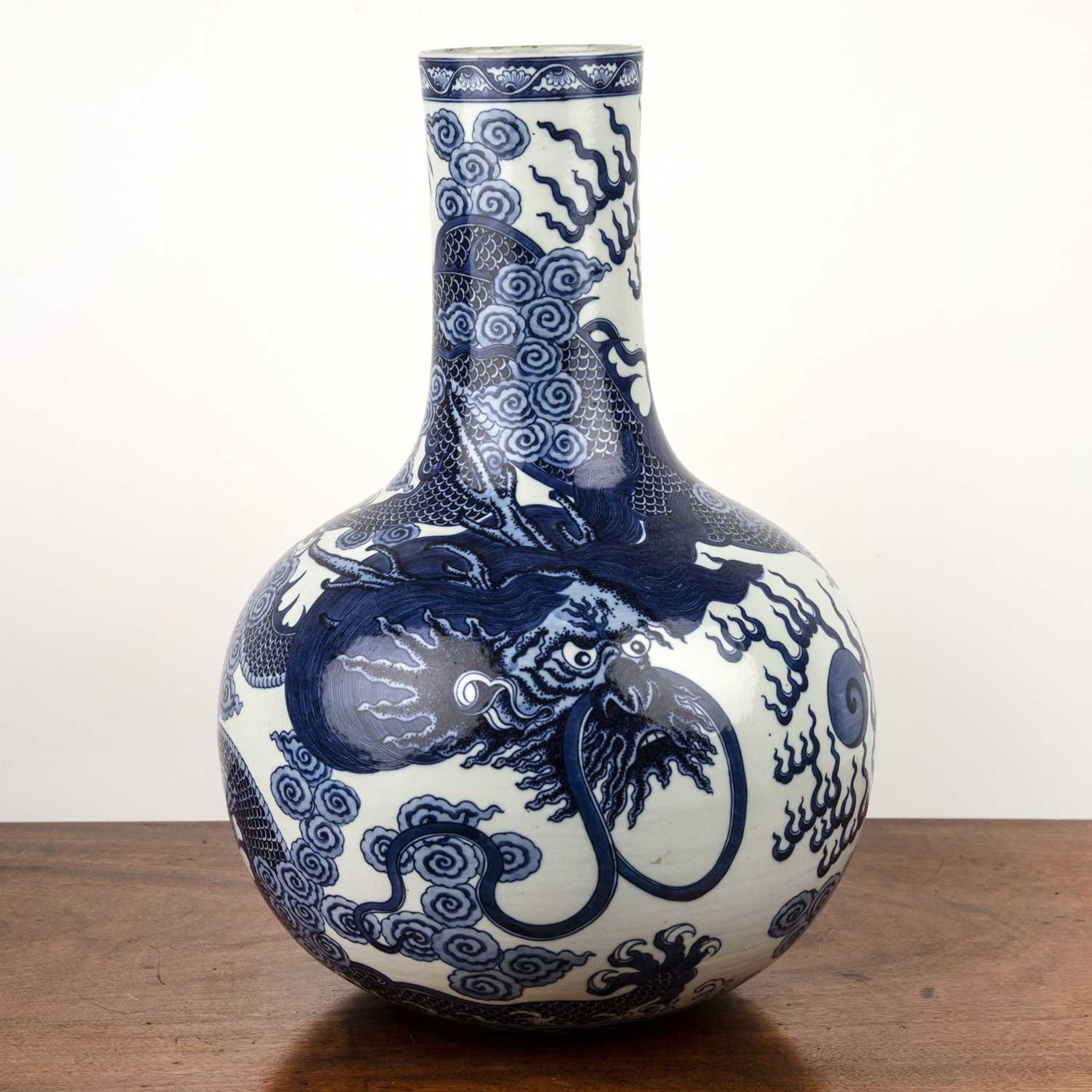 Large blue and white bottle vase Chinese, decorated to the body with a dragon chasing a flaming