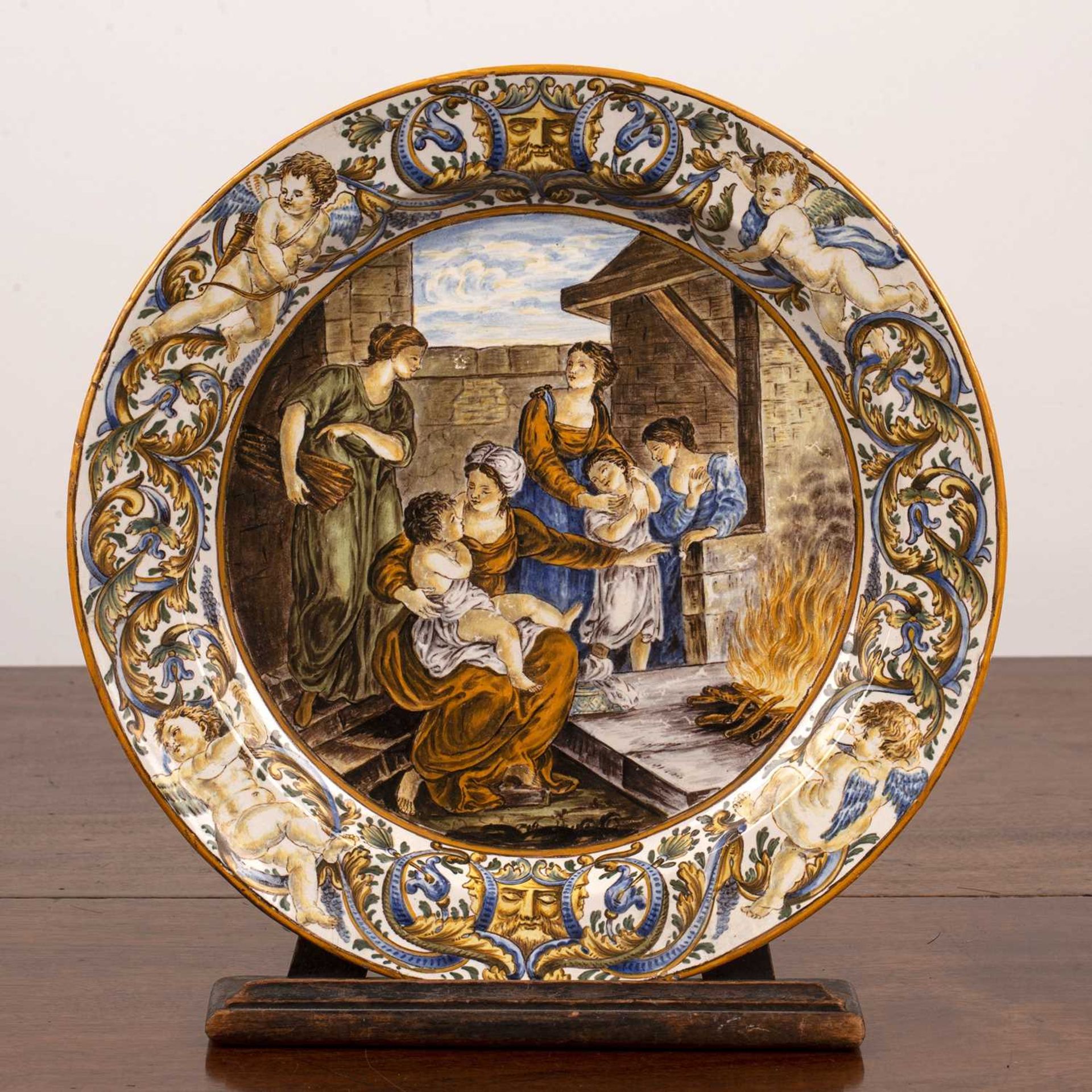 Castelli maiolica dish 19th Century, decorated with a scene depicting women and children, with a