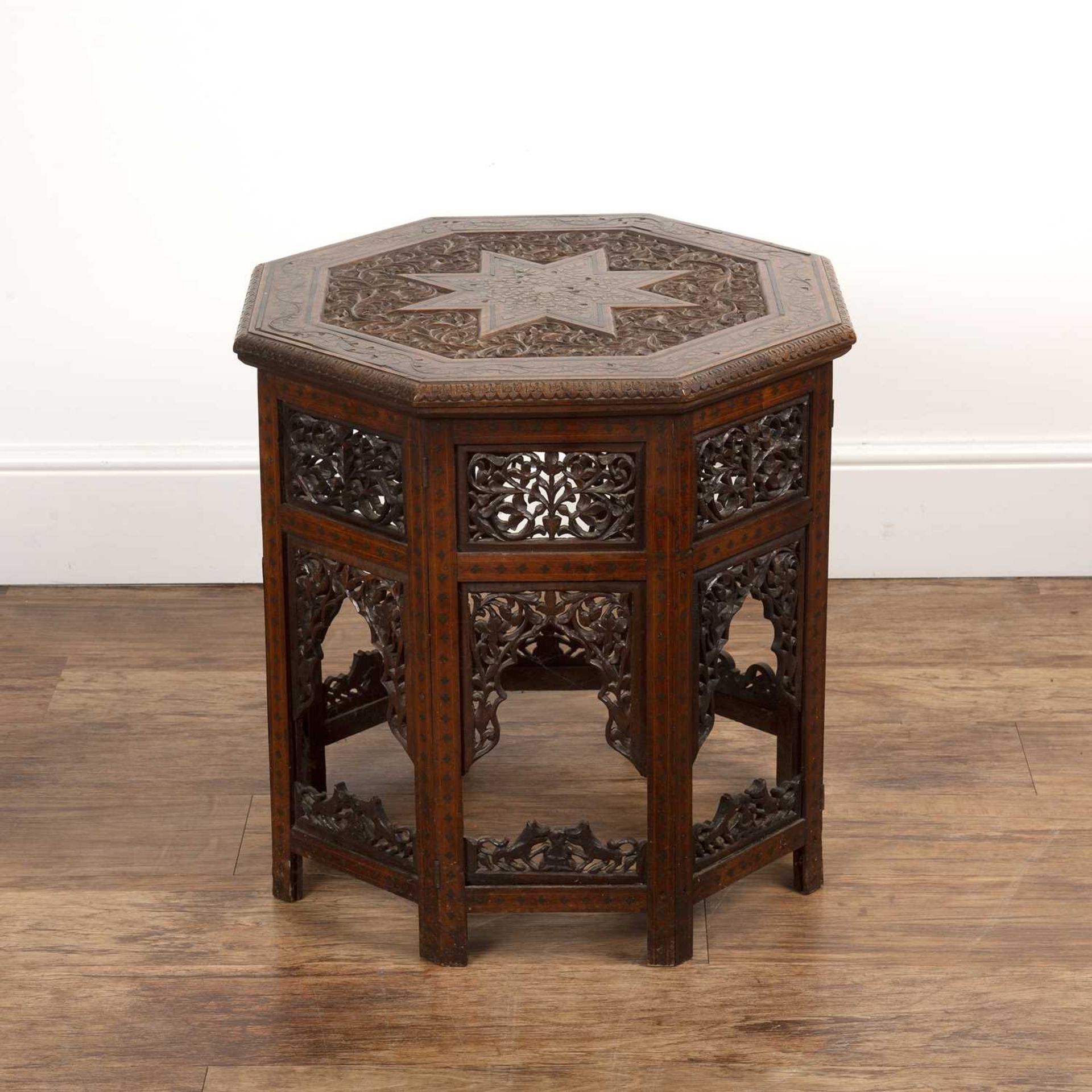 Octagonal occasional table Indian, circa 1900, with octagonal top with brass inlay of foliate