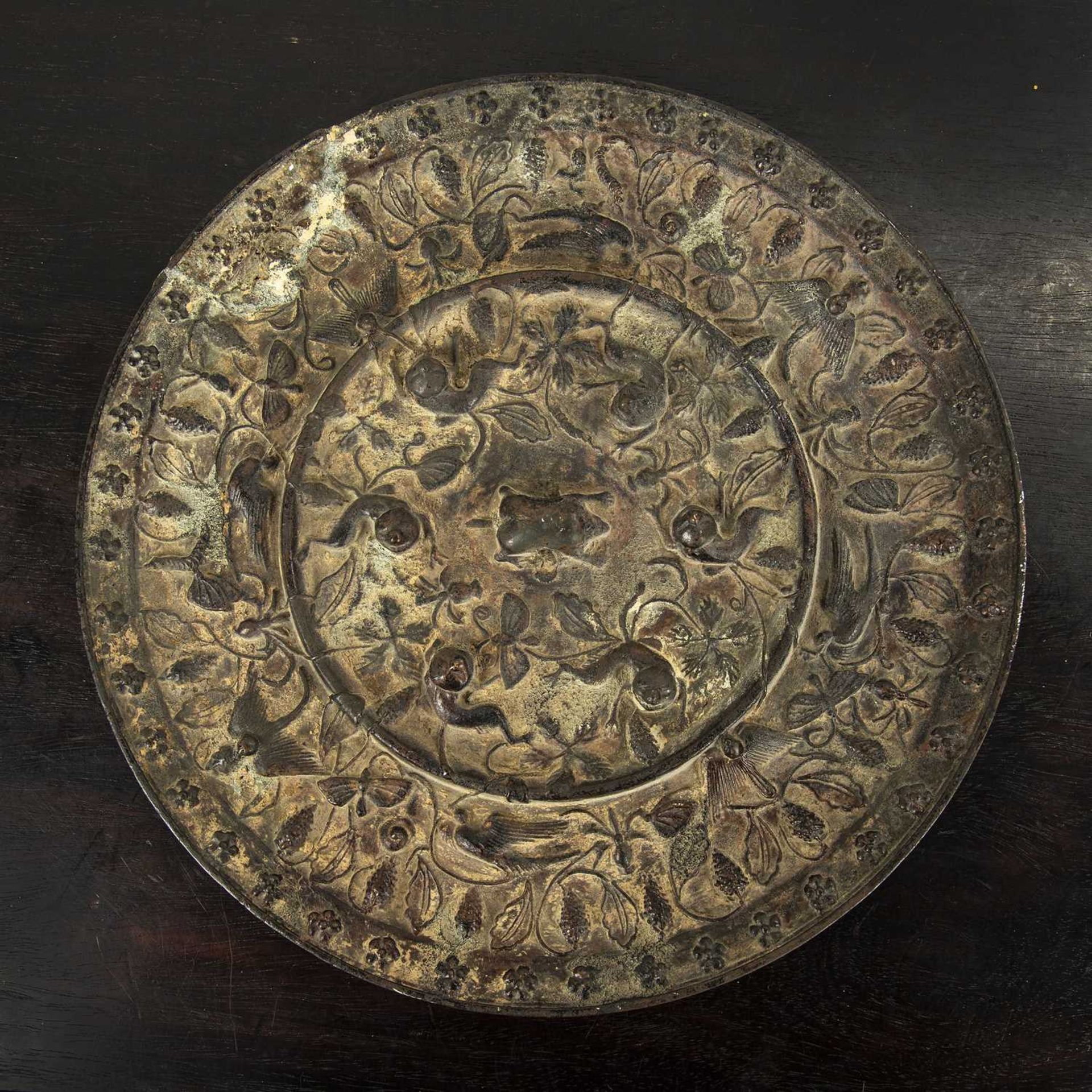Bronze TLV mirror Chinese, decorated with birds and other animals, set against flowers, 25cm