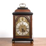Parcel ebonised and mahogany bracket or table clock, 18th Century, the break arch brass dial with