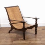 Plantation chair having a stained wood frame and woven rattan seat, 94cm high, 70cm wide overall x
