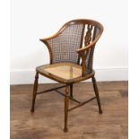 Edwardian bergere caned chair by Arthur Newbery Ltd, beech frame, with pierced wheel splat to the