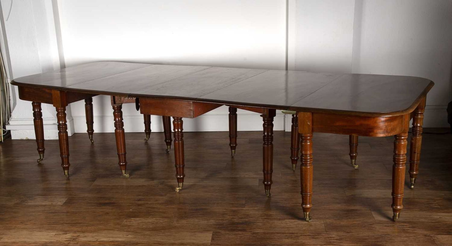 Mahogany D-end dining table 19th Century, with central drop-leaf on turned supports with brass - Bild 4 aus 4