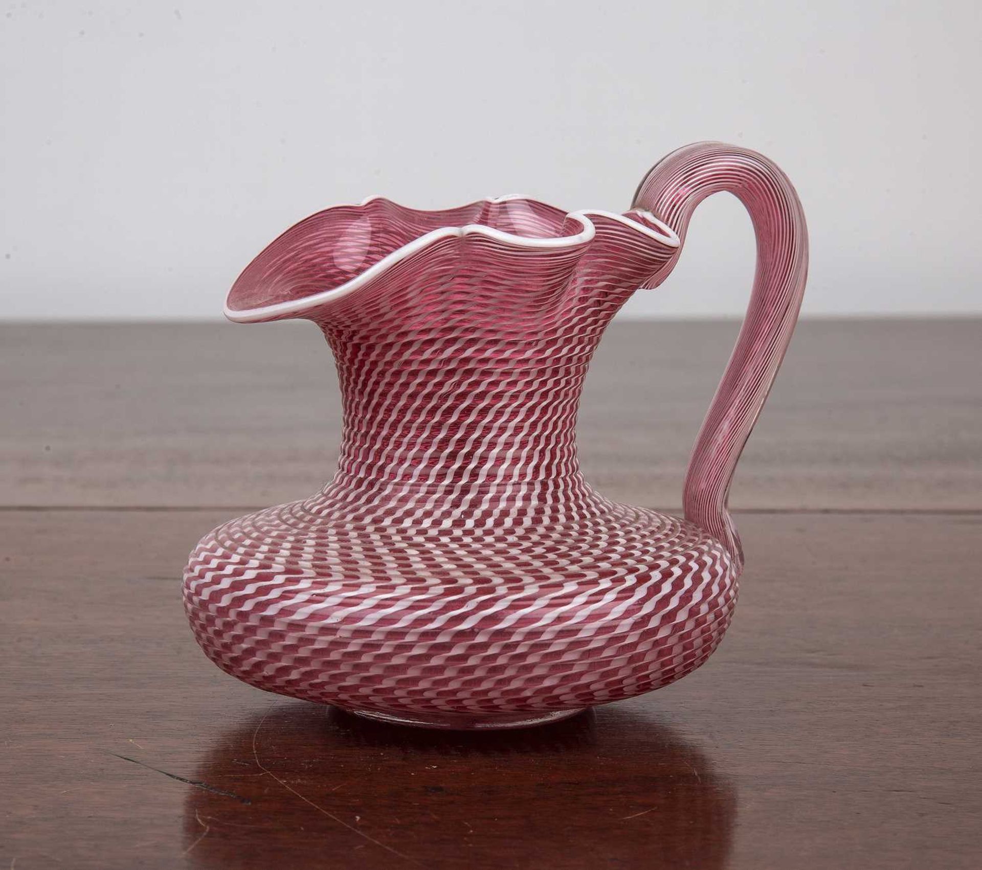 Clichy filigrana latticinio glass jug circa 1840-1860, of pink ground, 7.5cm highOverall ok, with