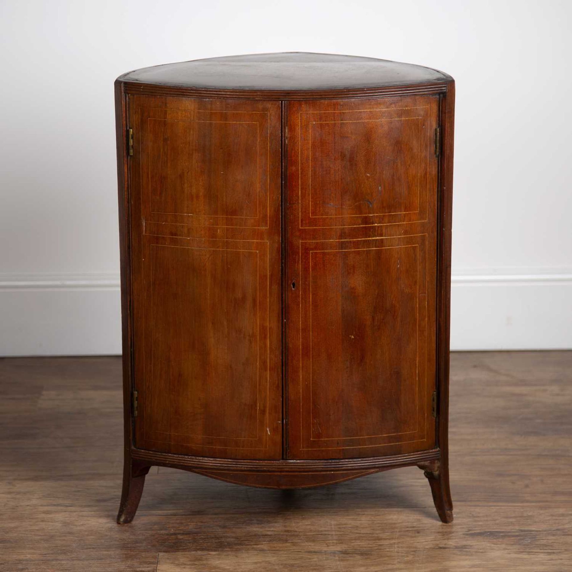 Mahogany and inlaid triangular cupboard 19th Century, with two panel doors, 49cm across x 69cm