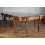 Mahogany D-end dining table 19th Century, with central drop-leaf on turned supports with brass