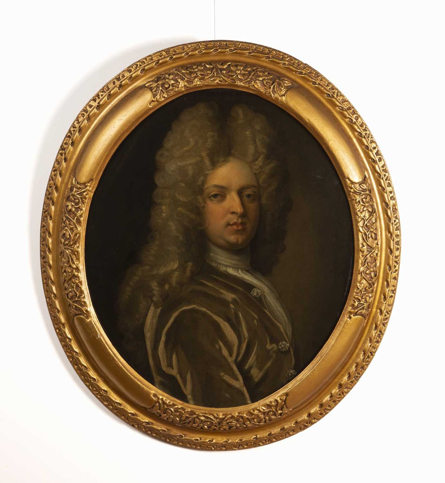 After Godfrey Kneller (1646-1723) Oval portrait of a nobleman wearing a green frockcoat, oil on - Image 2 of 3