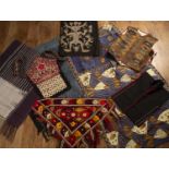 Quantity of Asian textiles comprising of a Sumba island-style beaded decorated wrap, a baby carrier,