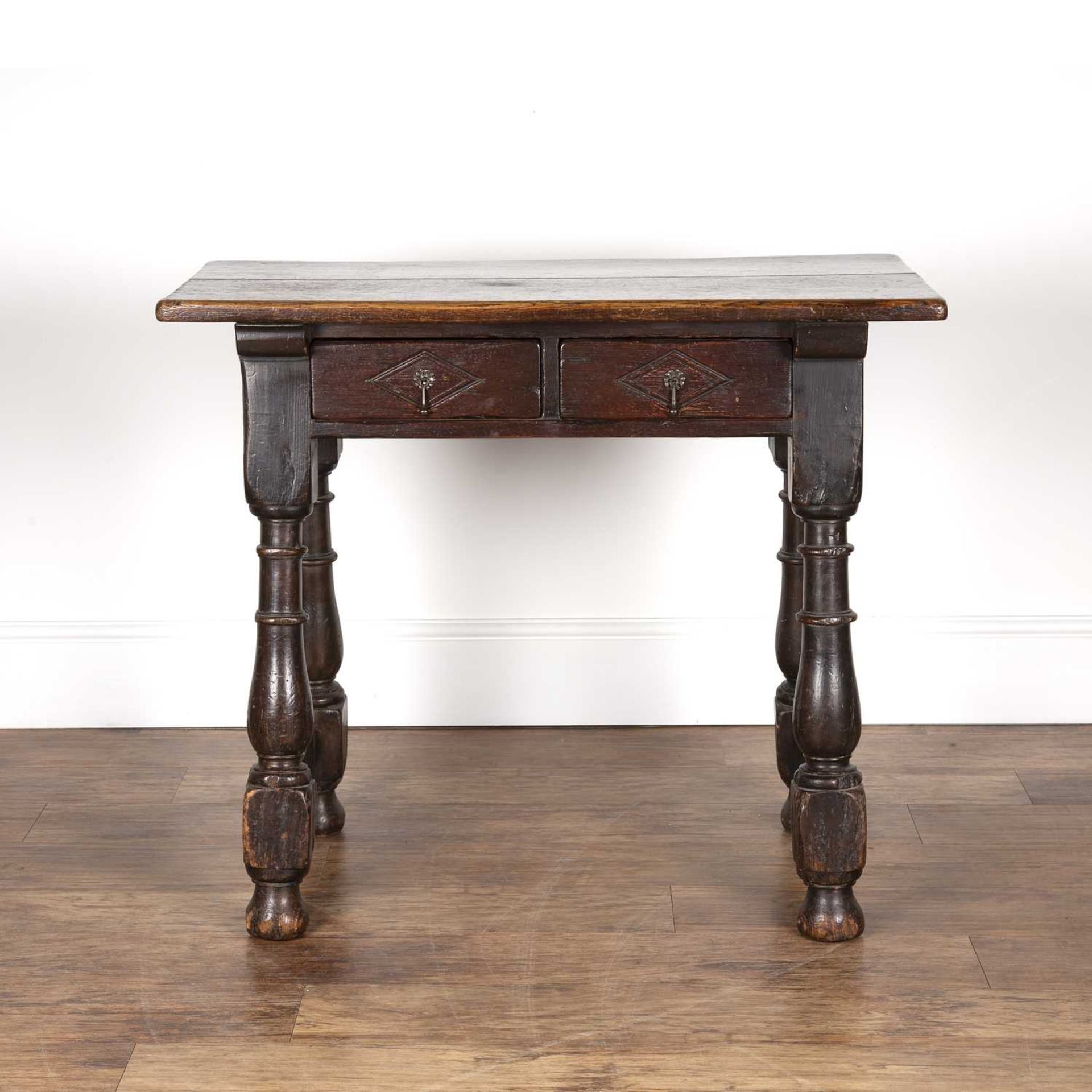 Oak side table 18th Century and later, fitted two carved drawers on turned supports and