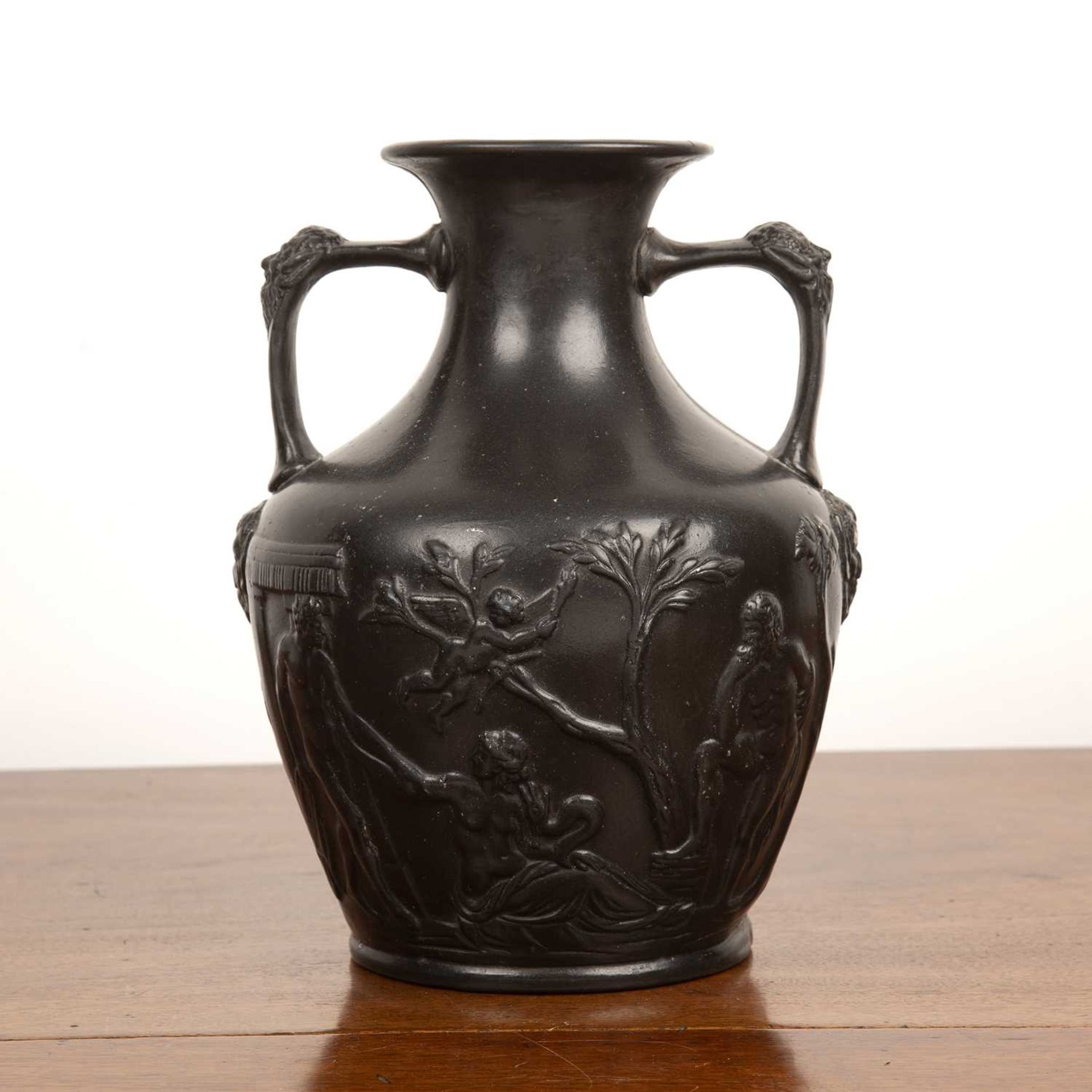 Black basalt copy of the Portland Vase impressed to the base 'Portland, 49E', 28cm highOld break