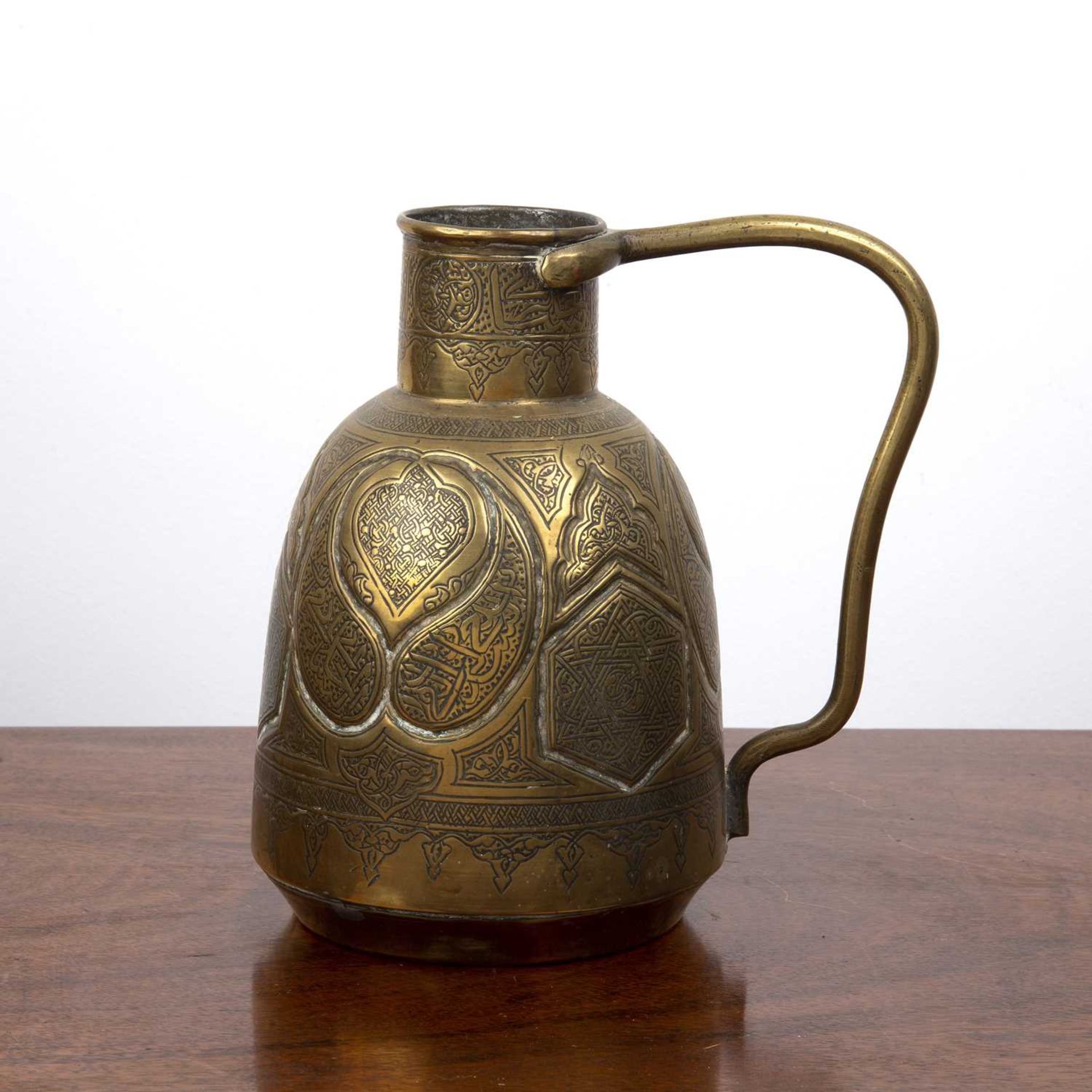 Qajar style jug Persian, with scrolling decoration, unmarked, 19cm high overall With overall wear,