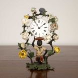 Porcelain, glass and blackamoor mantel clock the kneeling figure supporting an enamel clock face,