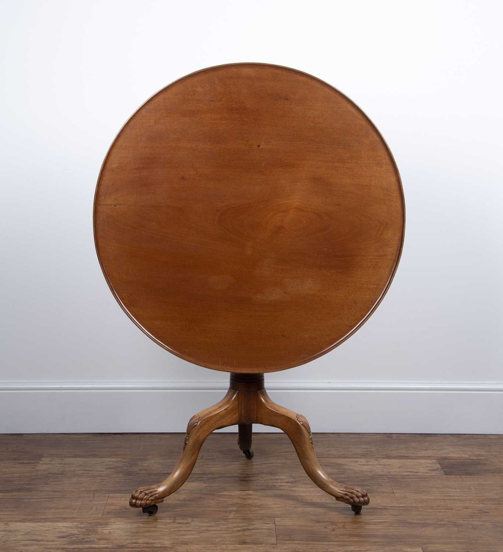 Mahogany tip-up large tripod table 19th Century, with tray top, turned column and carved supports