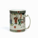 A Chinese porcelain tankard with enamelled figural decoration and four character marks to base, 16cm