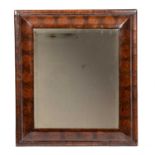 A William and Mary Laburnum oyster veneered cushion moulded mirror with a bevelled glass plate. 50cm
