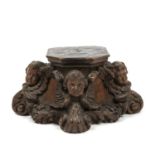 A 19th century continental plinth carved with winged cherubs, 21cm wide x 10.5cm highIn good