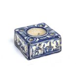An 18th century Continental tin glazed ink stand of square form, 10cm square x 5cm high