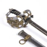 A REPLICA Edward VII British Officers dress sword with a cut steel pommel, a leather grip, the