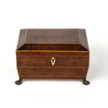 A George III burr yew wood sewing box with satinwood cross banding, of sarcophagus form with four