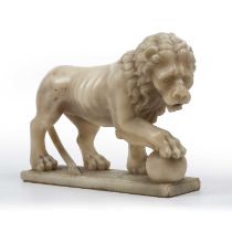 A late 18th/early 19th century carved alabaster lion 35cm wide x 25cm highSome hairline cracks to