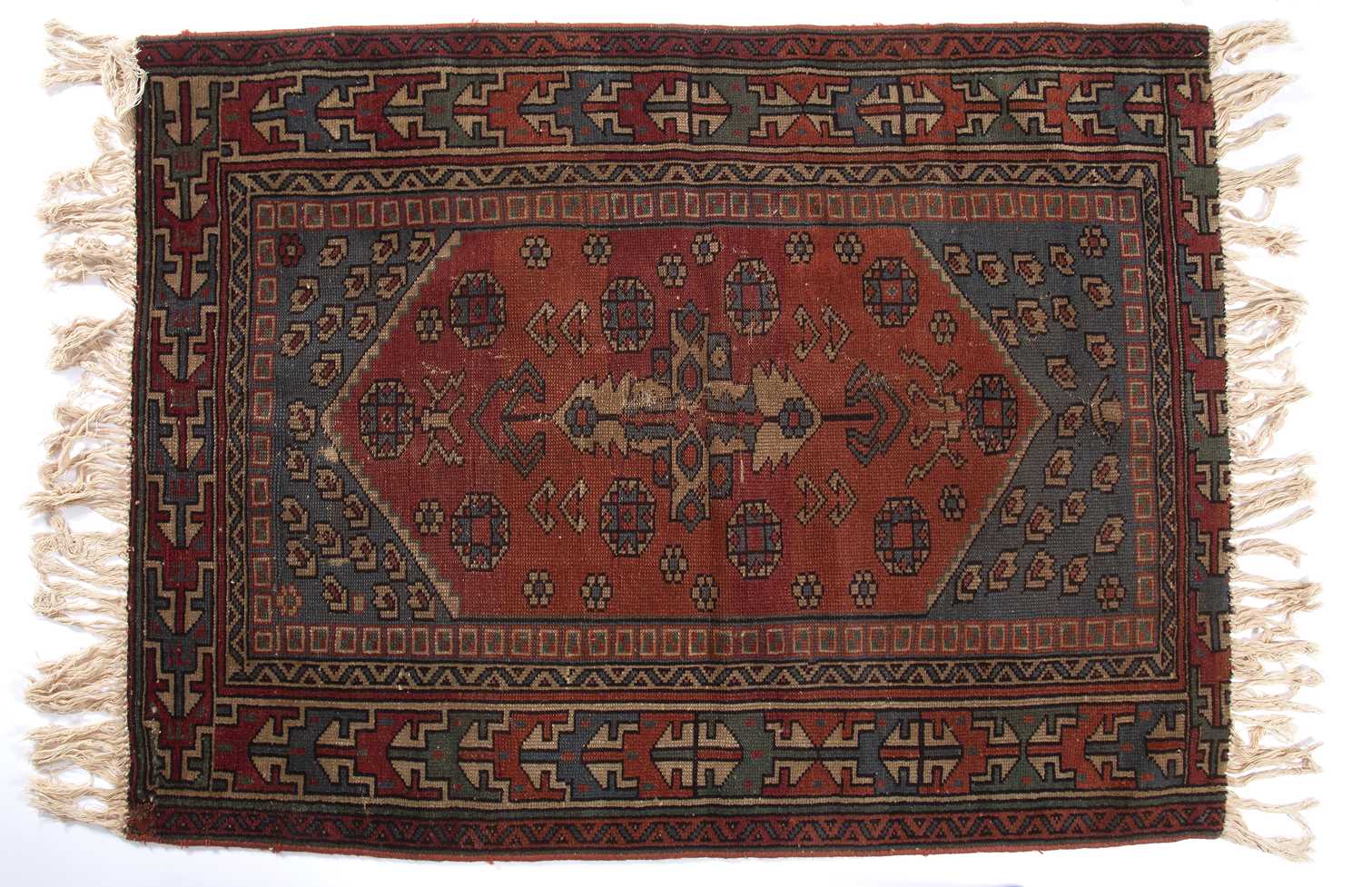 An early 20th century Middle Eastern red and blue ground rug with geometric foliate decoration. - Image 2 of 4