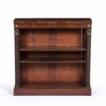A 19th century mahogany open bookcase with two adjustable open shelves, having reeded fronts and