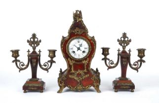 A late 19th century French red tortoiseshell and gilt metal garniture de cheminée mantel clock and