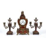 A late 19th century French red tortoiseshell and gilt metal garniture de cheminée mantel clock and